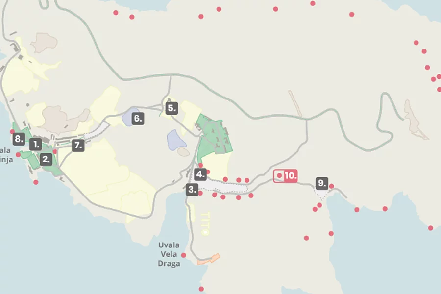 The map partially depicts Goli Otok, with various sites of significance marked by numbers and dotted symbols.